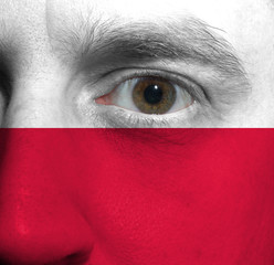 face with the Polish flag painted on it