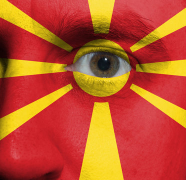 face with the Macedonian flag painted on it