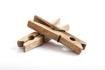 old wooden clothes pegs  on white background