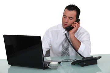 businessman talking on the phone in his office
