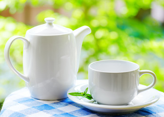 Cup of tea on nature background
