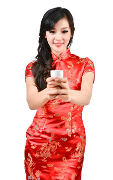 pretty women with Chinese traditional dress Cheongsam and drinki