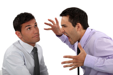 Businessman shouting at a colleague