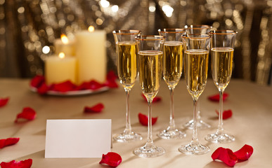 Gold glitter Wedding reception setting with champagne