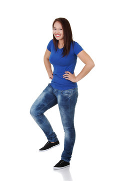 Happy casual woman with one leg up