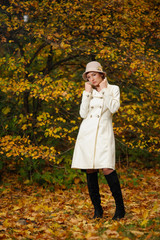 attractive woman in evening autumn park