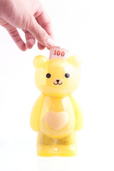 Bears a yellow piggy bank