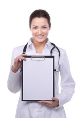 Portrait of cheerful female doctor with clipboard, isolated over