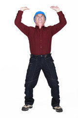 mature manual worker lifting weight