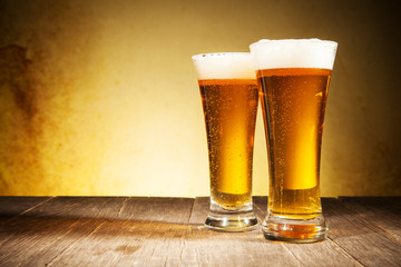 Glass of beers on wooden table