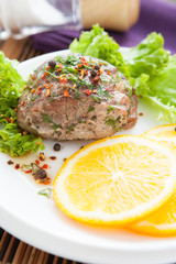 large piece of juicy meat baked with orange