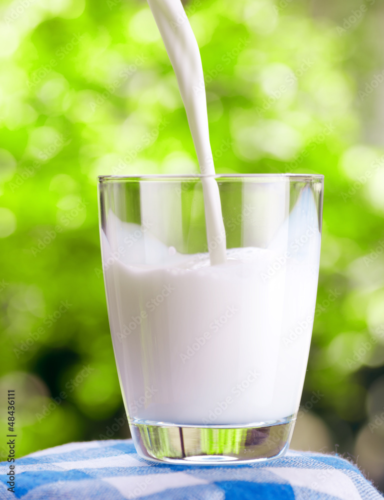 Canvas Prints glass of milk on nature background