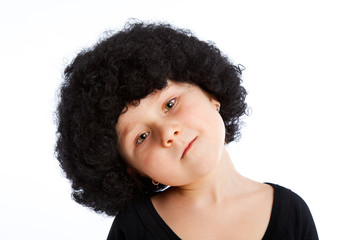 Girl child with afro wig.