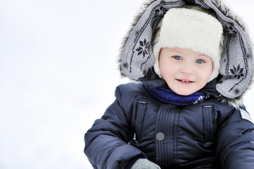 Adorable little boy in winter - closeup