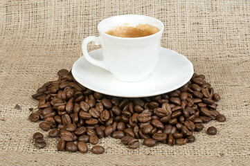 Cup of coffee and coffee beans
