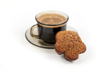 Closeup of chocolate muffin and a cup of coffee