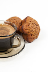 Closeup of chocolate muffin and a cup of coffee