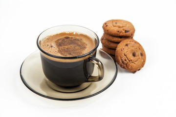 Closeup of chocolate cookies and a cup on white background