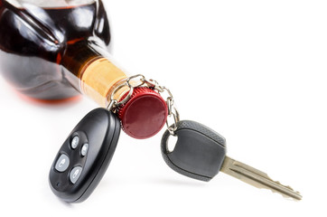 glass of alcohol and car keys