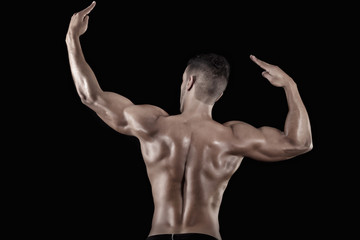 Fototapeta na wymiar muscled man on a black background
