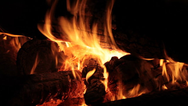 Burning firewood on fireplace, campfire