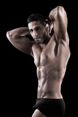 Fototapeta premium muscled man on a black background
