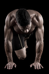 Obraz premium muscled man on a black background
