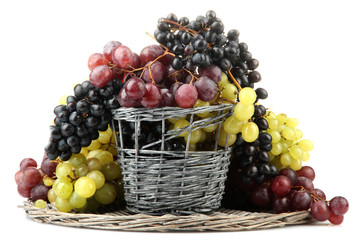 assortment of ripe sweet grapes in basket, isolated on white.