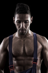 muscled man on a black background