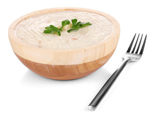 Mashed potatoes in wooden bowl isolated on white