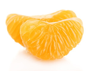 Ripe sweet tangerine  cloves, isolated on white