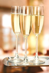 Corporate party: sparkling champagne glasses on tray