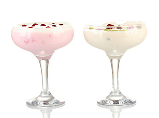 Glasses of yoghurt dessert with fruits and berries, isolated