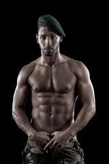 Fototapeta na wymiar muscled man on a black background