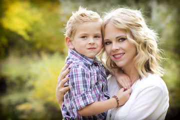 Fototapeta na wymiar Beautiful blond Mother and Cute son Portrait