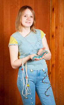 girl shows   cloth beaded by herself
