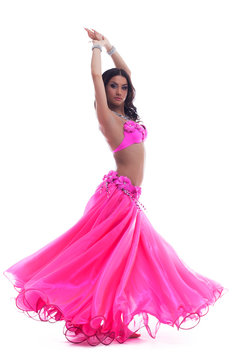 Young dancer in pink costume isolated
