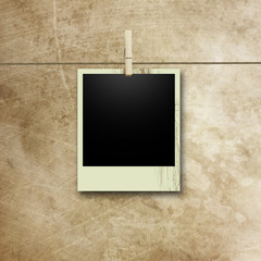 Vintage polaroid photo on line with peg