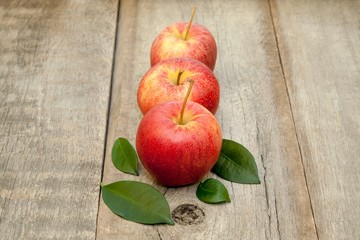 Fresh apples on the wooden floor