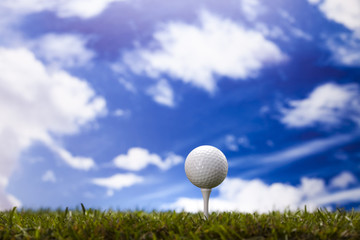 Golf ball on green meadow