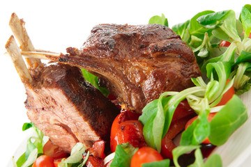 Rare fried rack of lamb isolated on white