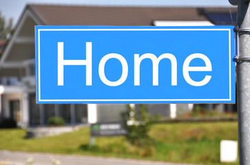 Obraz premium HOME sign against a house