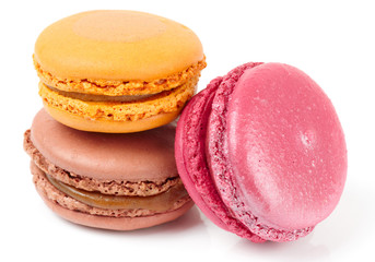 Three colorful macarons on white background