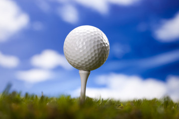 Golf ball on green meadow