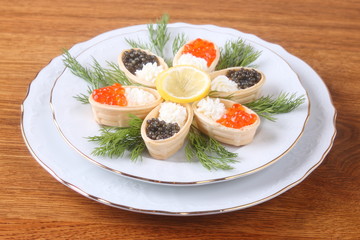 Canapes with cream cheese and caviar