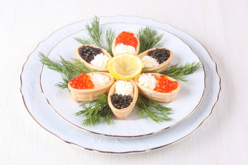 Canapes with cream cheese and caviar