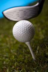Golf ball on green meadow