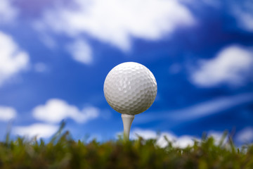 Golf ball on green meadow