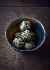 Green tea balls in a ceramic dish