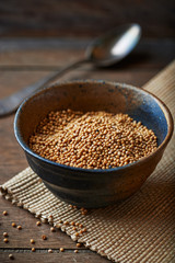 Mustard seeds in a ceramic dish